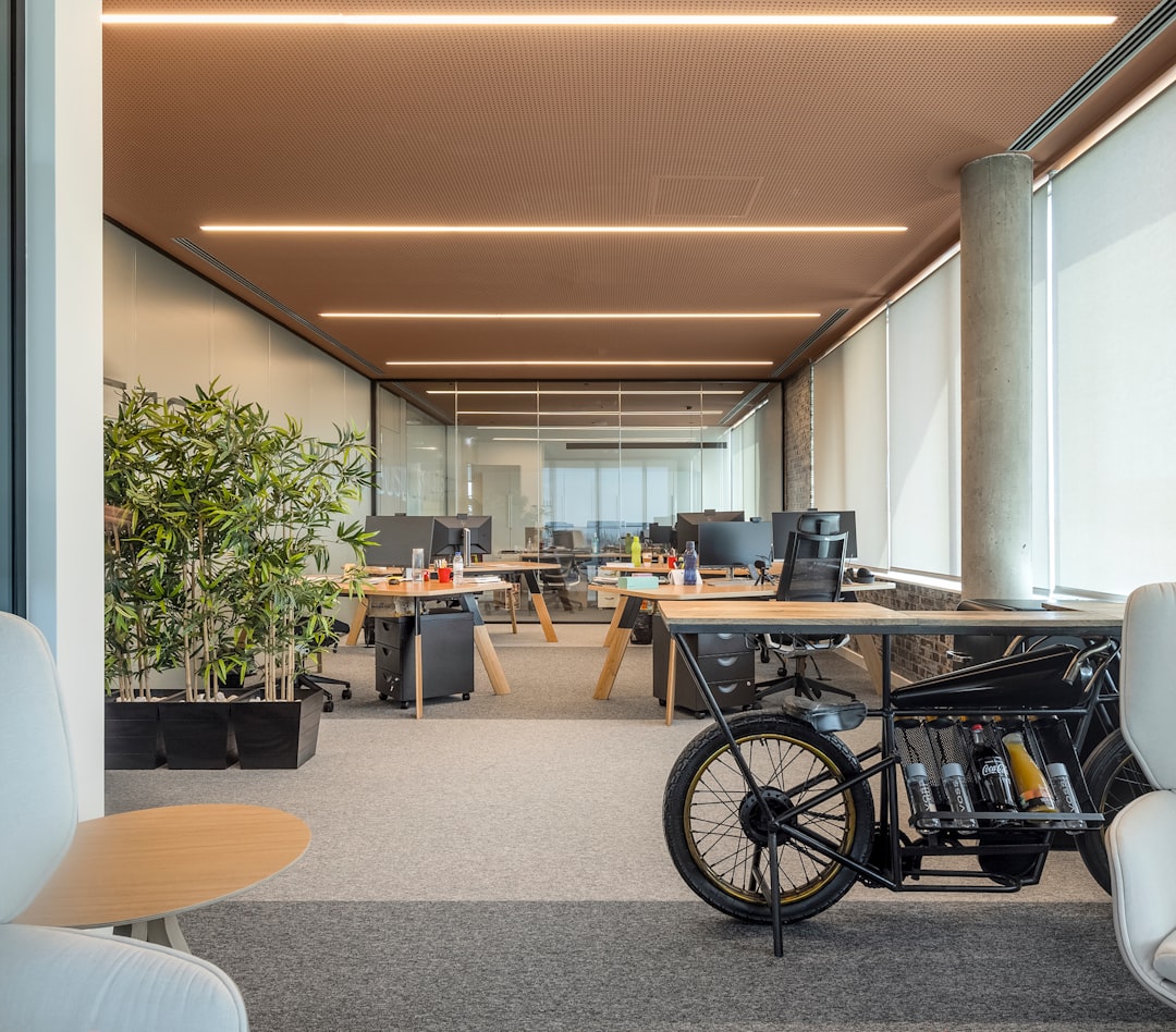 modern office with tech devices and glass walls